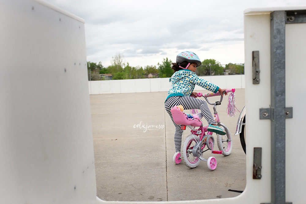 Lafayette Preschool getting on her bike