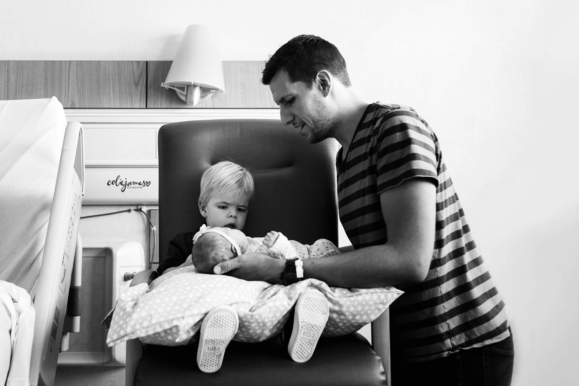 denver newborn photographer hold your baby sister