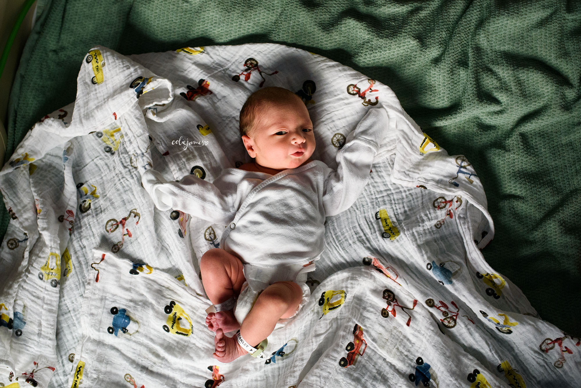 Littleton Newborn Photographer photographs baby on Little Unicorn Swaddle Blanket